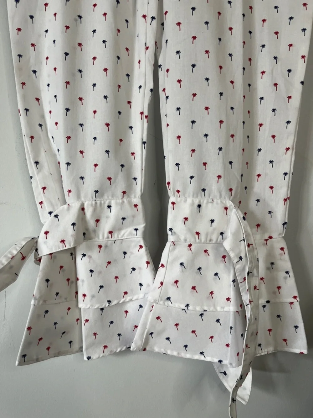 White Cropped Pants with Red & Navy Palm Print w/Ruffled Ties on each leg.  Sz L
